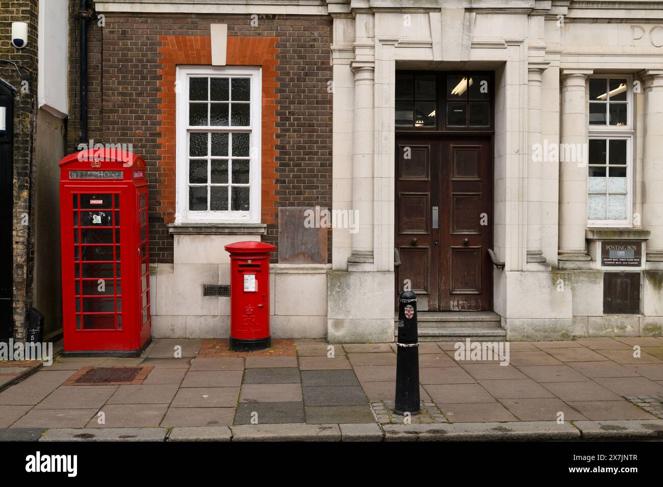 A K6 phone box and a red post box outside the closed-down Rochester Head Post Office, Eastgate, Rochester, Kent, UK.  23 Apr 2024 Stock Photo