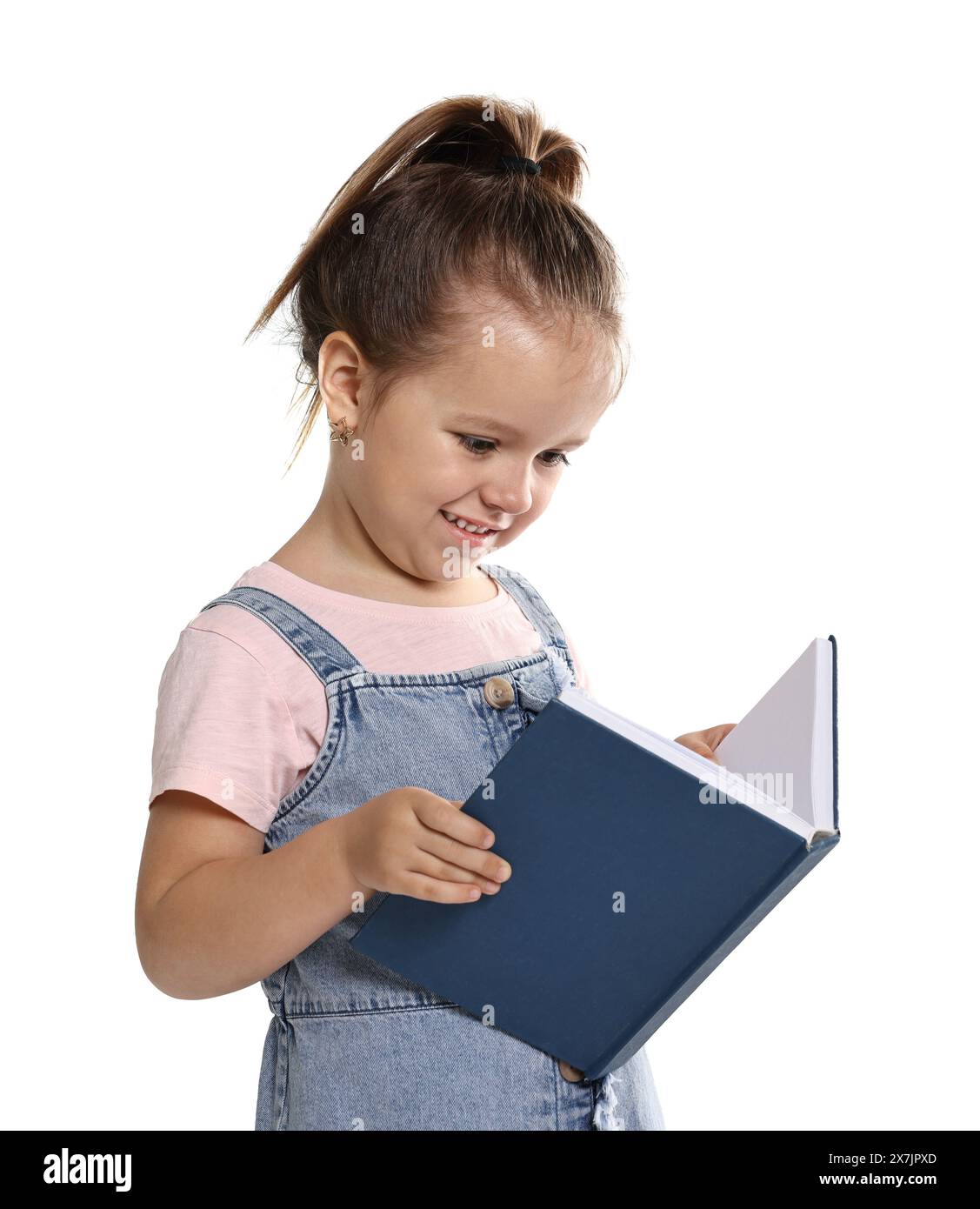 Cute little girl reading book on white background Stock Photo - Alamy