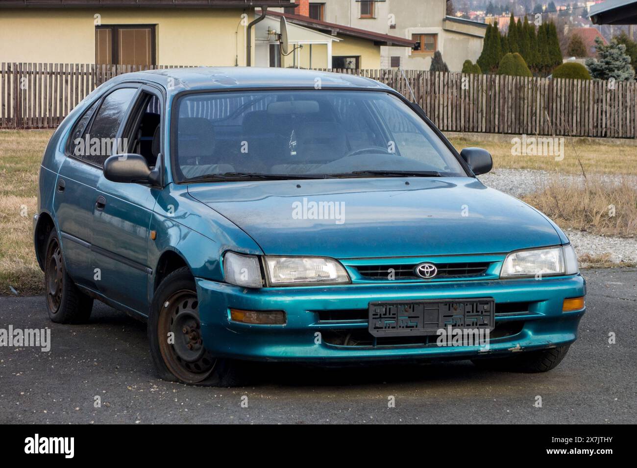 FRYDEK-MISTEK, CZECH REPUBLIC - MARCH 25, 2018: Abandoned azure blue Toyota Corolla hatchback car from 90s with a flat tire. The image was taken on Ma Stock Photo