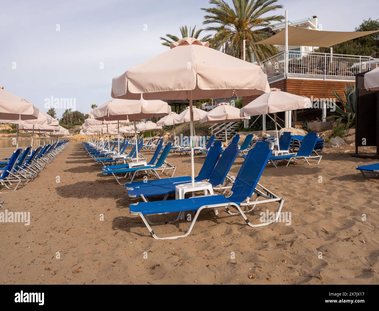 May 2024 Rows of beach umbrellas and sunbeds near Pafos, Cyprus Stock