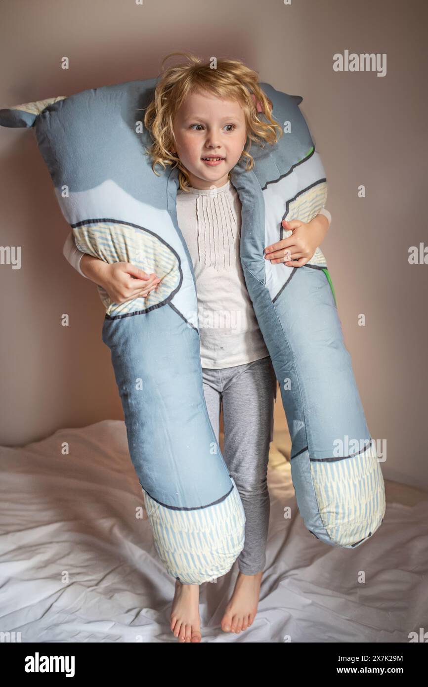 Little Girl Holding Large Stuffed Animal Stock Photo - Alamy