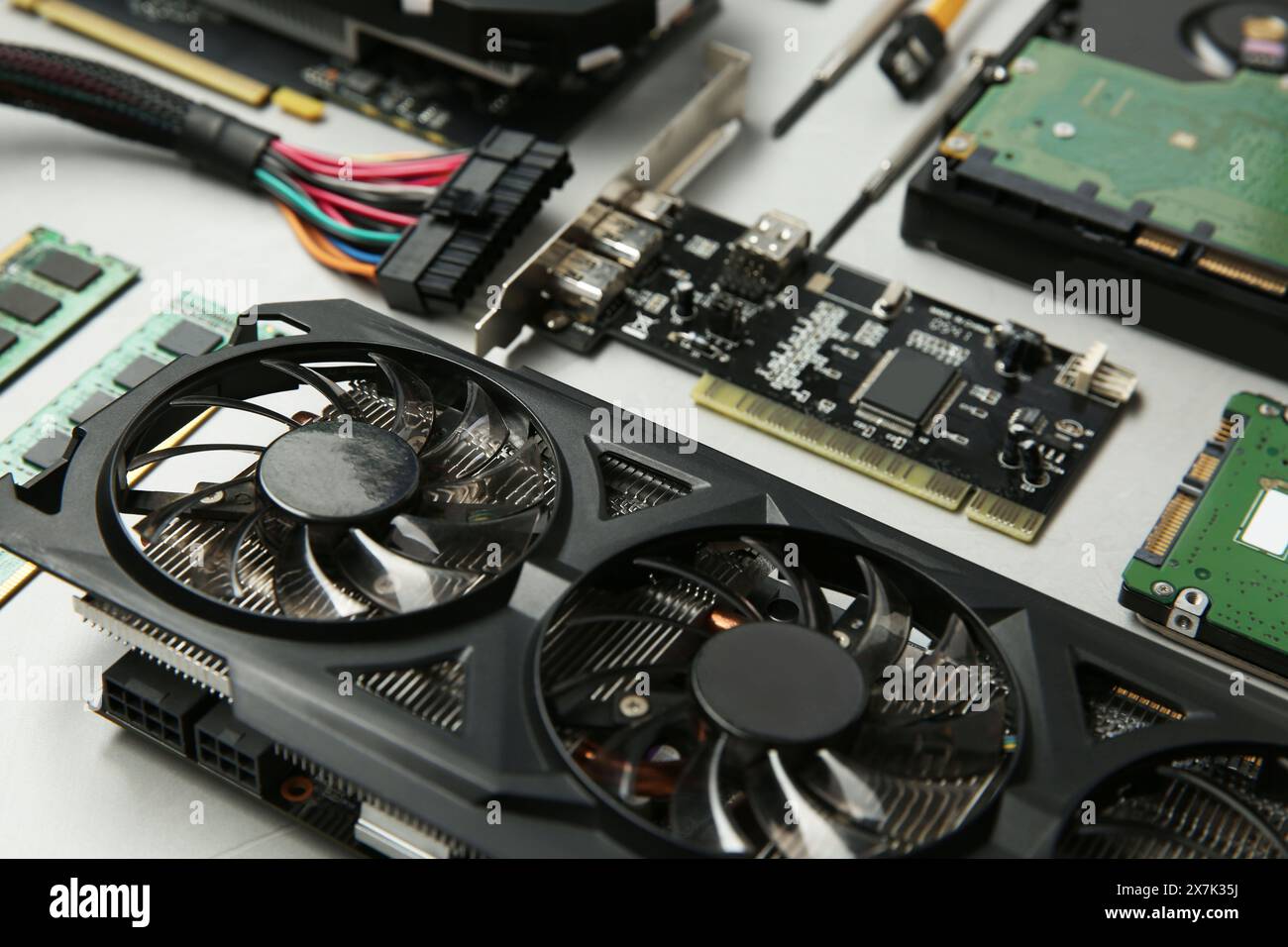Graphics card and other computer hardware on gray background, closeup Stock Photo