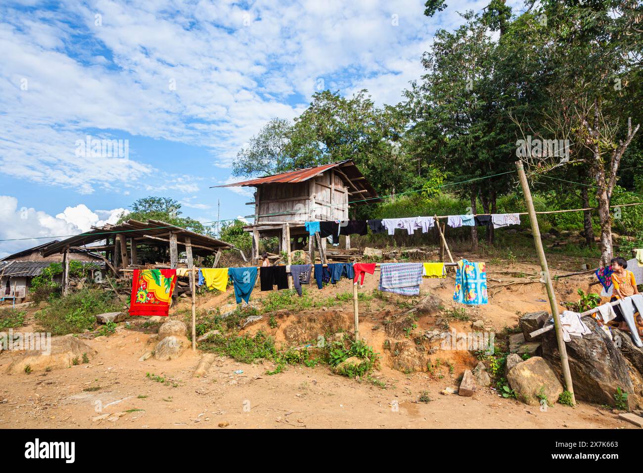 View of a Lahu village with washing hanging out to dry near Lanjia Lodge in Chiang Khong in Chiang Rai province, northern Thailand Stock Photo