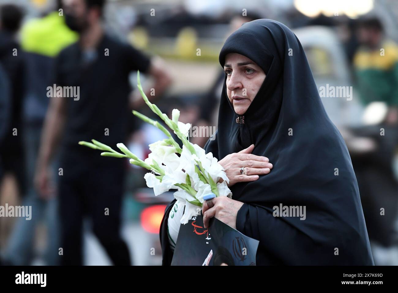 Tehran, Iran. 20th May, 2024. A woman mourns victims of the helicopter crash near Varzaqan County, in Tehran, Iran, on May 20, 2024. Iranian President Ebrahim Raisi and some members of his accompanying team, including Foreign Minister Hossein Amir-Abdollahian, were confirmed dead Monday morning as the wreckage of the helicopter carrying them was found following its crash in bad weather on Sunday near Varzaqan County. Credit: Xinhua/Alamy Live News Stock Photo
