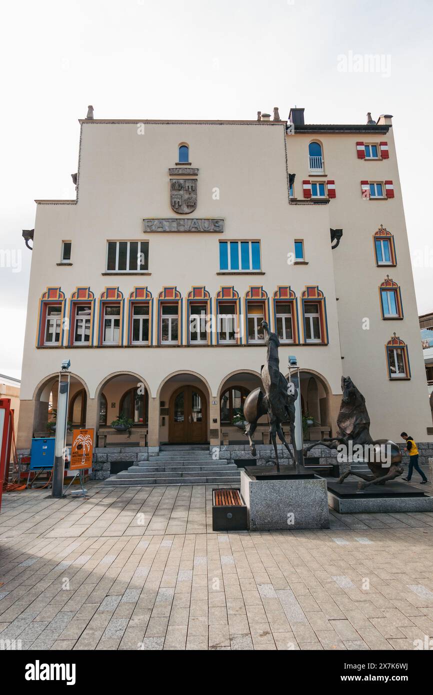 The historic Vaduz town hall building in Liechtenstein, featuring a bronze statue of a horse and rider out front Stock Photo