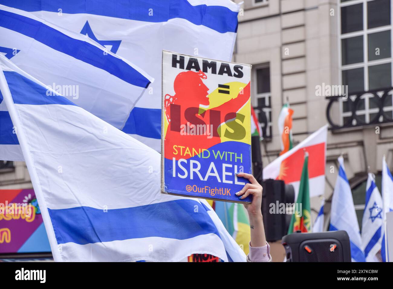 London, UK. 18th May, 2024. A pro-Israel supporter holds a sign equating Hamas with ISIS during the counter-protest in Piccadilly Circus. Thousands of people marched in solidarity with Palestine on the 76th anniversary of the Nakba as Israel continues its attacks on Gaza. (Photo by Vuk Valcic/SOPA Images/Sipa USA) Credit: Sipa USA/Alamy Live News Stock Photo