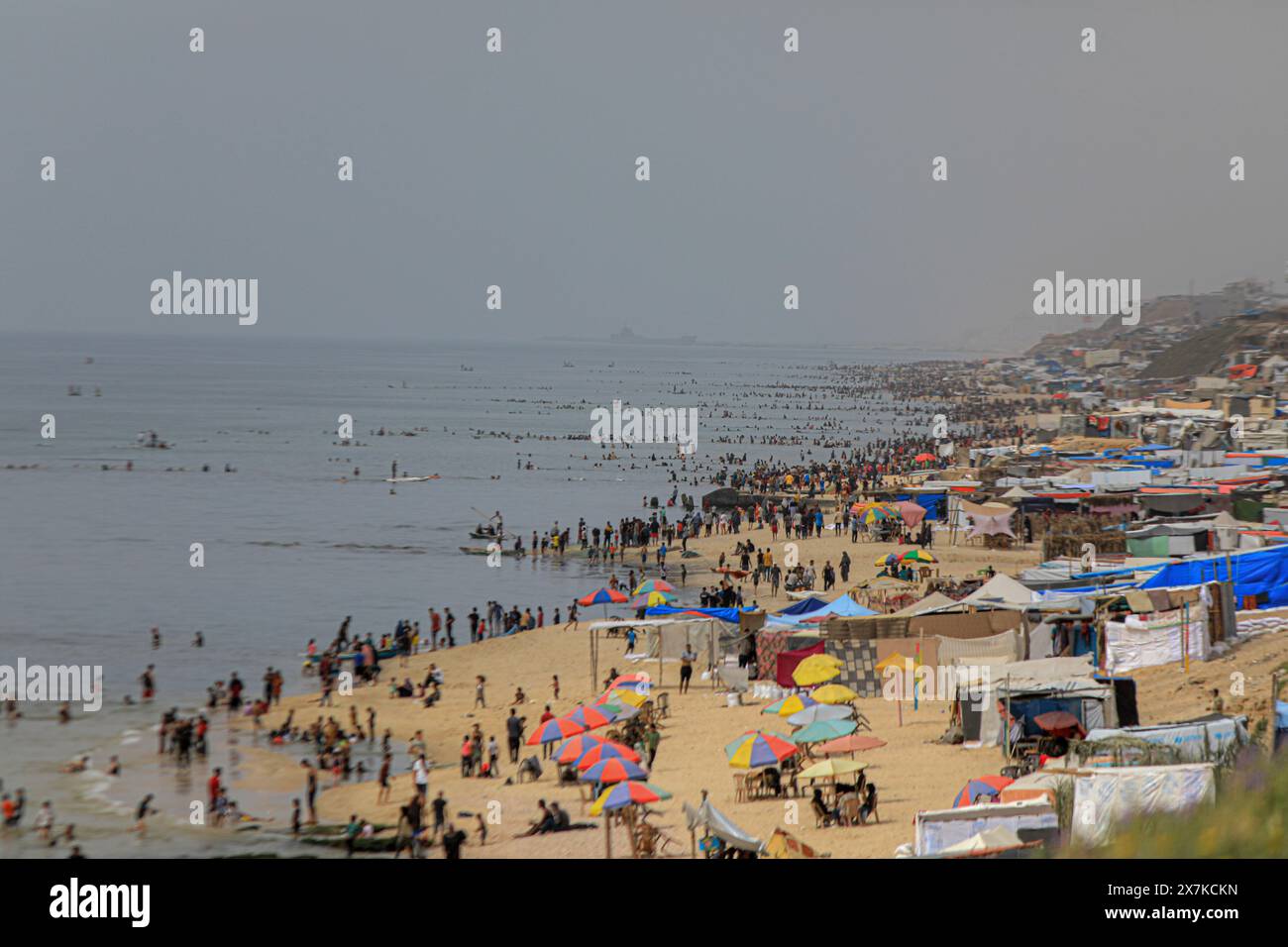 Gaza. 20th May, 2024. People spend time at the seaside during hot weather in the city of Deir al-Balah, central Gaza Strip, on May 20, 2024. Credit: Rizek Abdeljawad/Xinhua/Alamy Live News Stock Photo