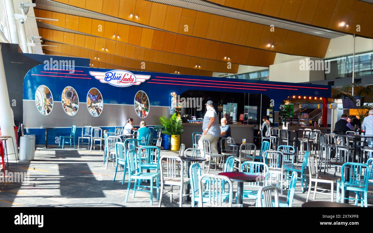 Wellington, New Zealand - February 21, 2024: Passengers dining at the Blue Lady restaurant prior to their flight departures at Wellington Internationa Stock Photo