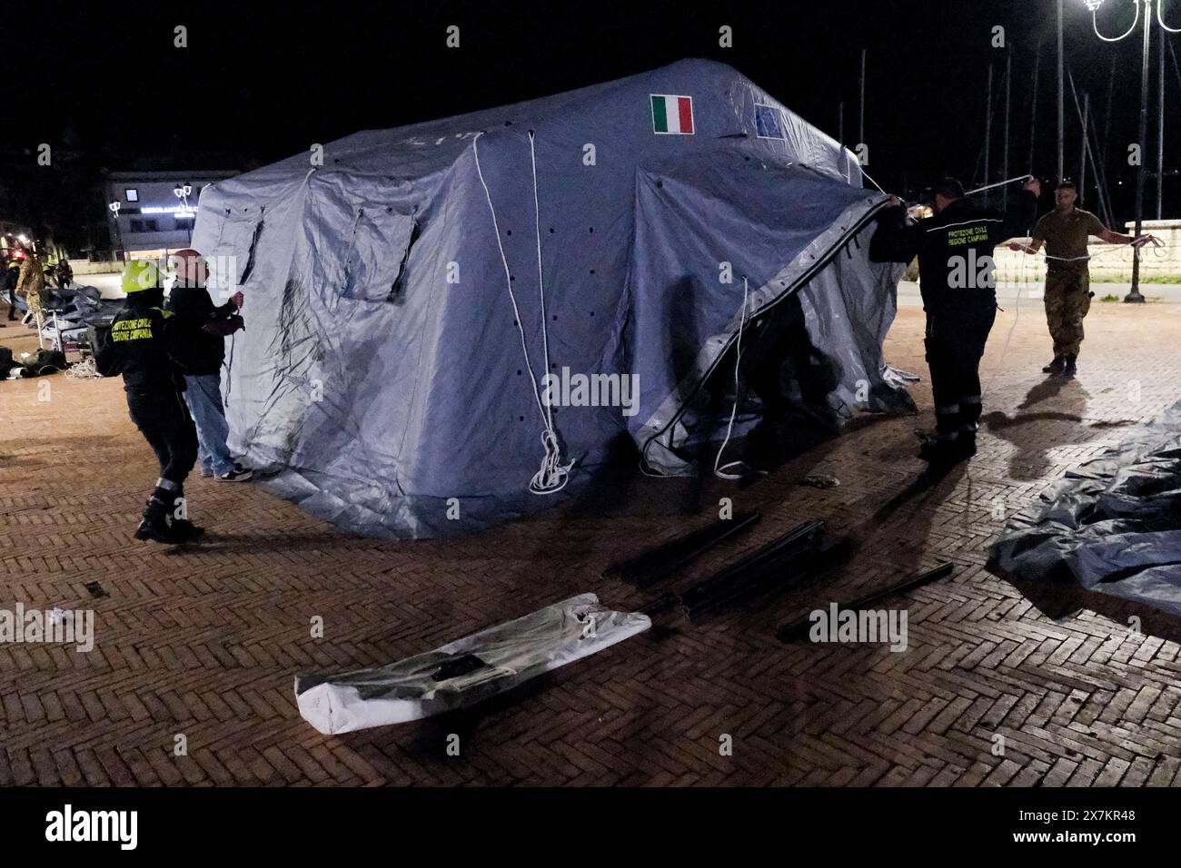 Italy: Campi Flegrei, bradisismo Campania s civil protection set up a tensile structure at the port of pozzuoli for people who are not confident about returning to their homes after the earthquake tremors, near Naples, southern Italy, 20 May 2024. The tremor that occurred at 8.10pm with epicentre in the Campi Flegrei was of magnitude 4.4. This was reported by the National Institute of Geophysics and Volcanology, according to which the depth of the quake was three kilometres. ABP01850 Copyright: xAntonioxBalascox Stock Photo