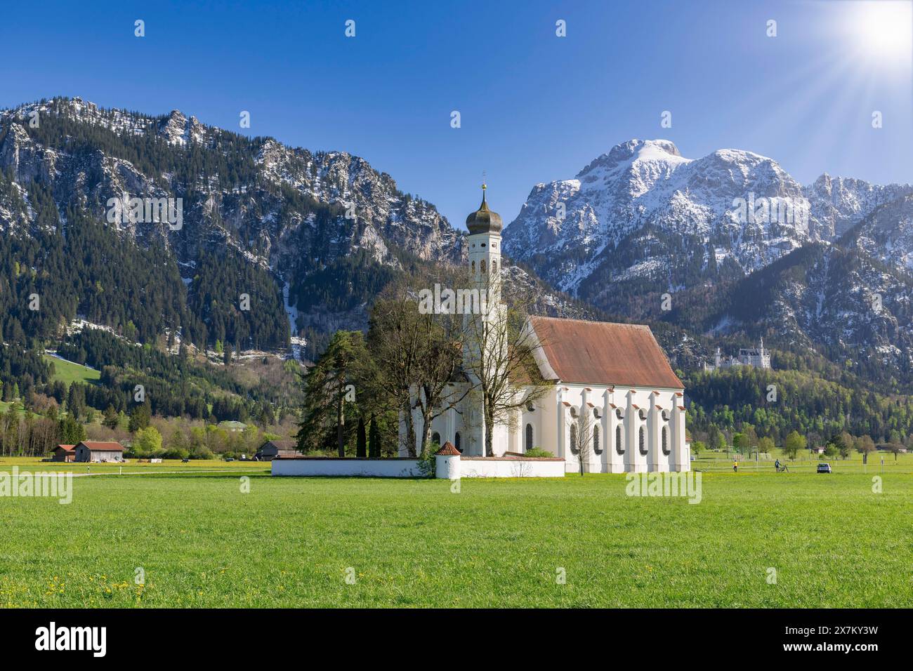 Pilgrimage church of St Coloman in spring, sun, behind Neuschwanstein ...