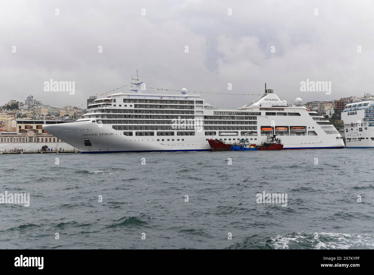 White cruise ship SIVER SPIRIT, with several decks on a rough sea on a grey day, Istanbul Modern, Istanbul, Turkey Stock Photo