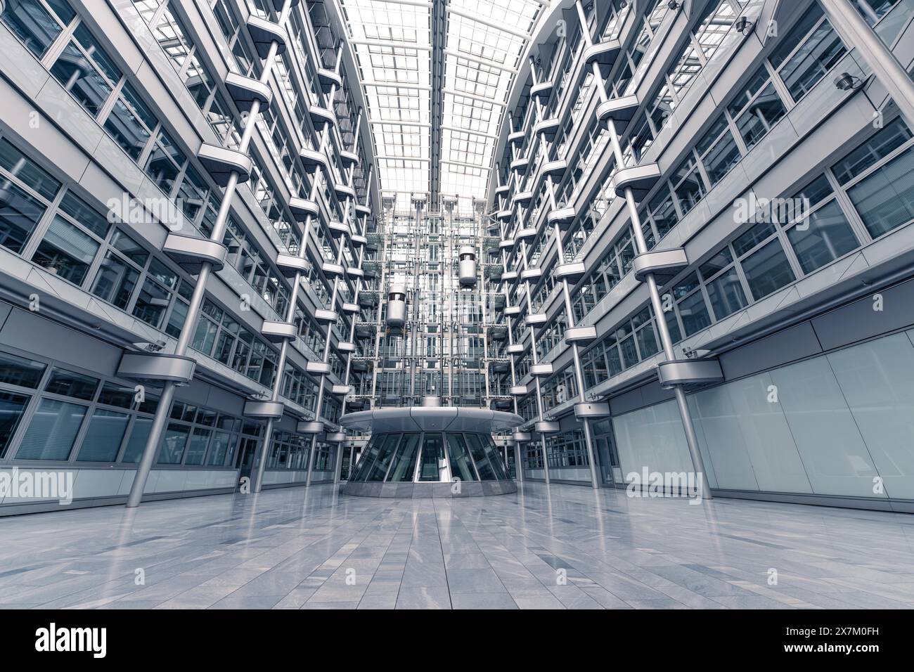 Wide-angle shot of a modern office building with glass facades and symmetrical structure, Berlin, IHK, Germany Stock Photo