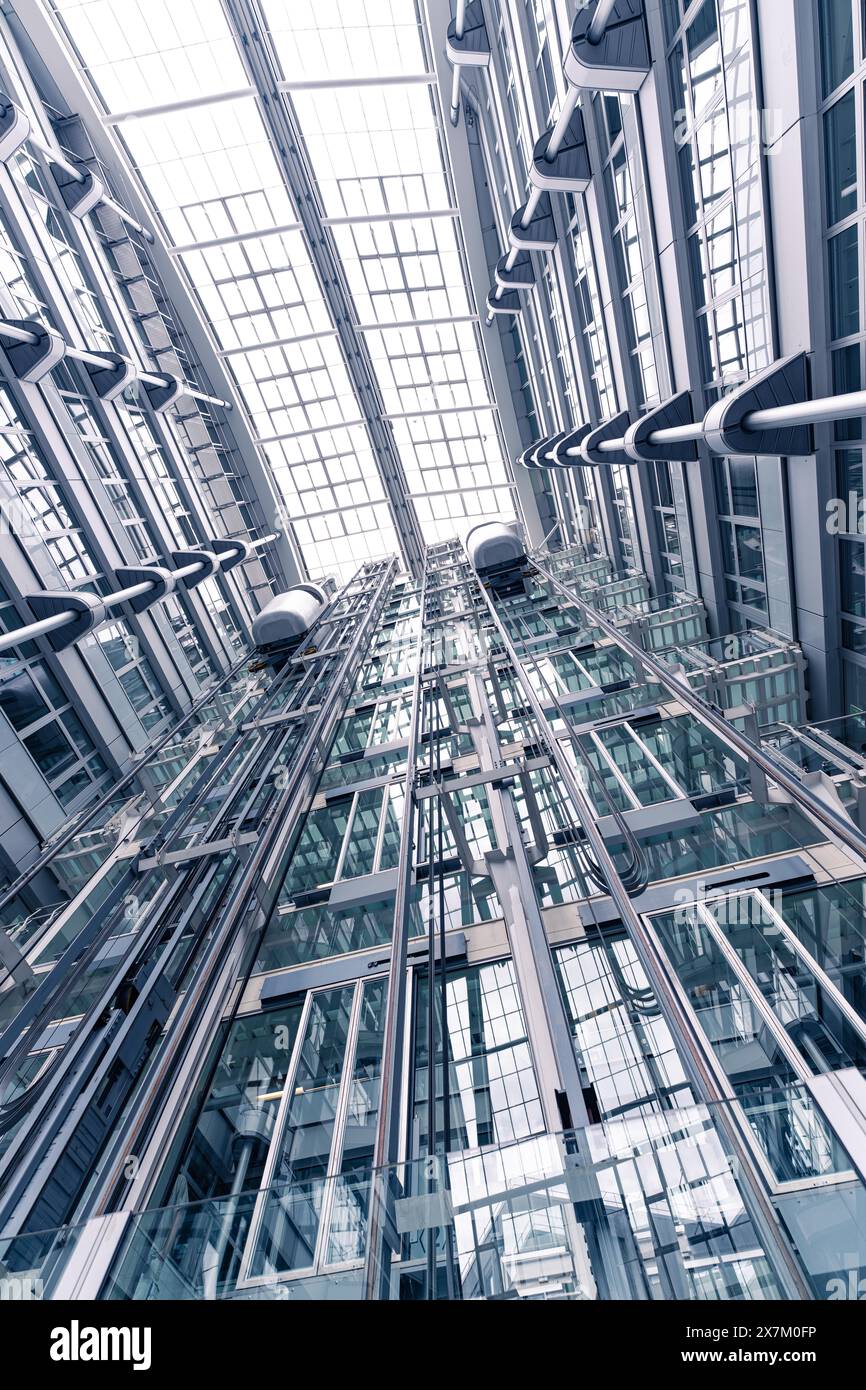 View upwards on a glass facade of a modern office building, Berlin, IHK, Germany Stock Photo