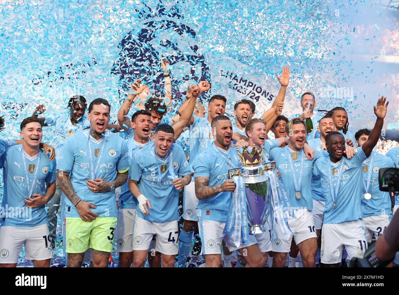 Beijing, China. 21st May, 2024. Players of Manchester City celebrate with the Premier League trophy after the English Premier League football match between Manchester City and West Ham United in Manchester, Britain, on May 19, 2024. Credit: Xinhua/Alamy Live News Stock Photo