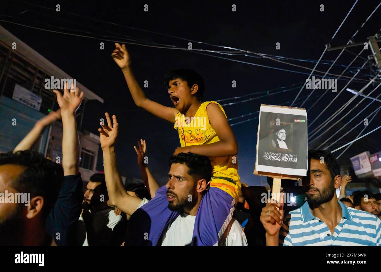 Srinagar, Kashmir. 20th May, 2024. A Kashmiri Shia Muslim boy shouts ...