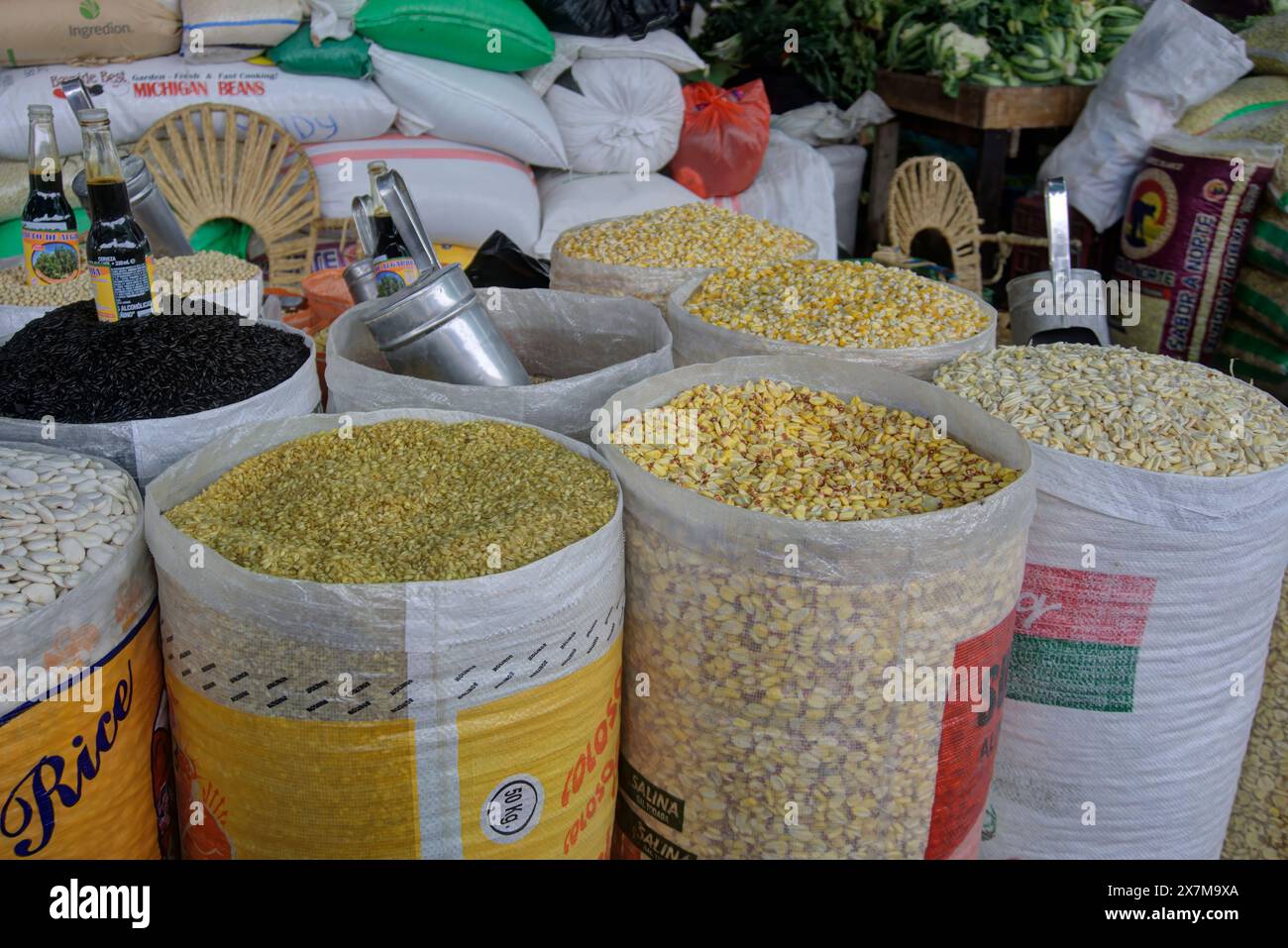 Chimbote, Peru - April 18, 2024: Bags of various grain types for sale in public market Mercado dos de Mayo (2nd May Market) Stock Photo