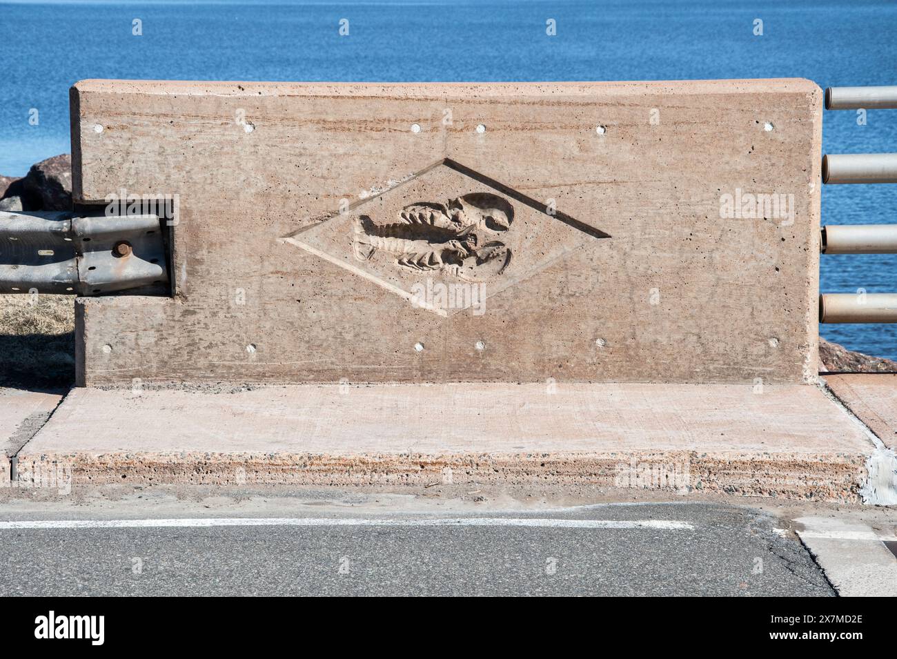 Embossed lobster logo on the barrier on the Foch Bridge in Shediac, New Brunswick, Canada Stock