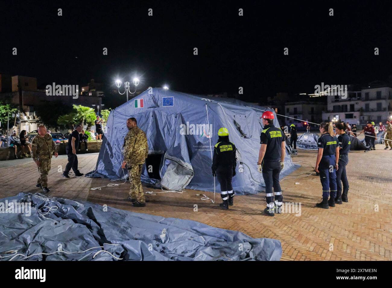 News - Italy: Campi Flegrei, bradisismo Campania s civil protection set up a tensile structure at the port of pozzuoli for people who are not confident about returning to their homes after the earthquake tremors, near Naples, southern Italy, 20 May 2024. The tremor that occurred at 8.10pm with epicentre in the Campi Flegrei was of magnitude 4.4. This was reported by the National Institute of Geophysics and Volcanology, according to which the depth of the quake was three kilometres. Napoli Pozzuoli Italy Copyright: xAntonioxBalascox/xLiveMediax LPN 1364592 Stock Photo