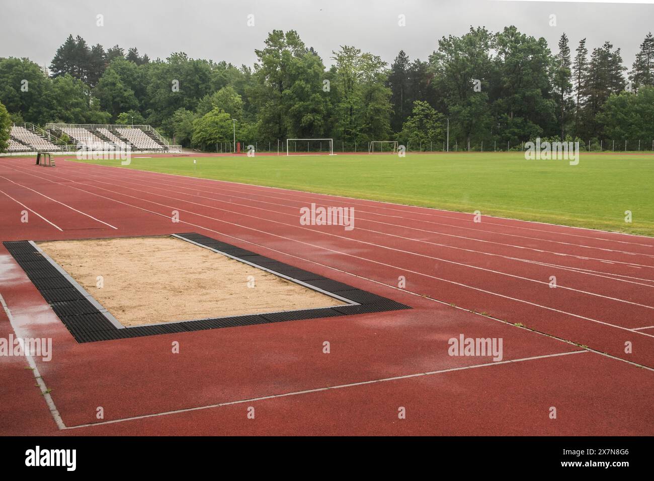Long jump sand pit and track and field lines in stadium Stock Photo Alamy