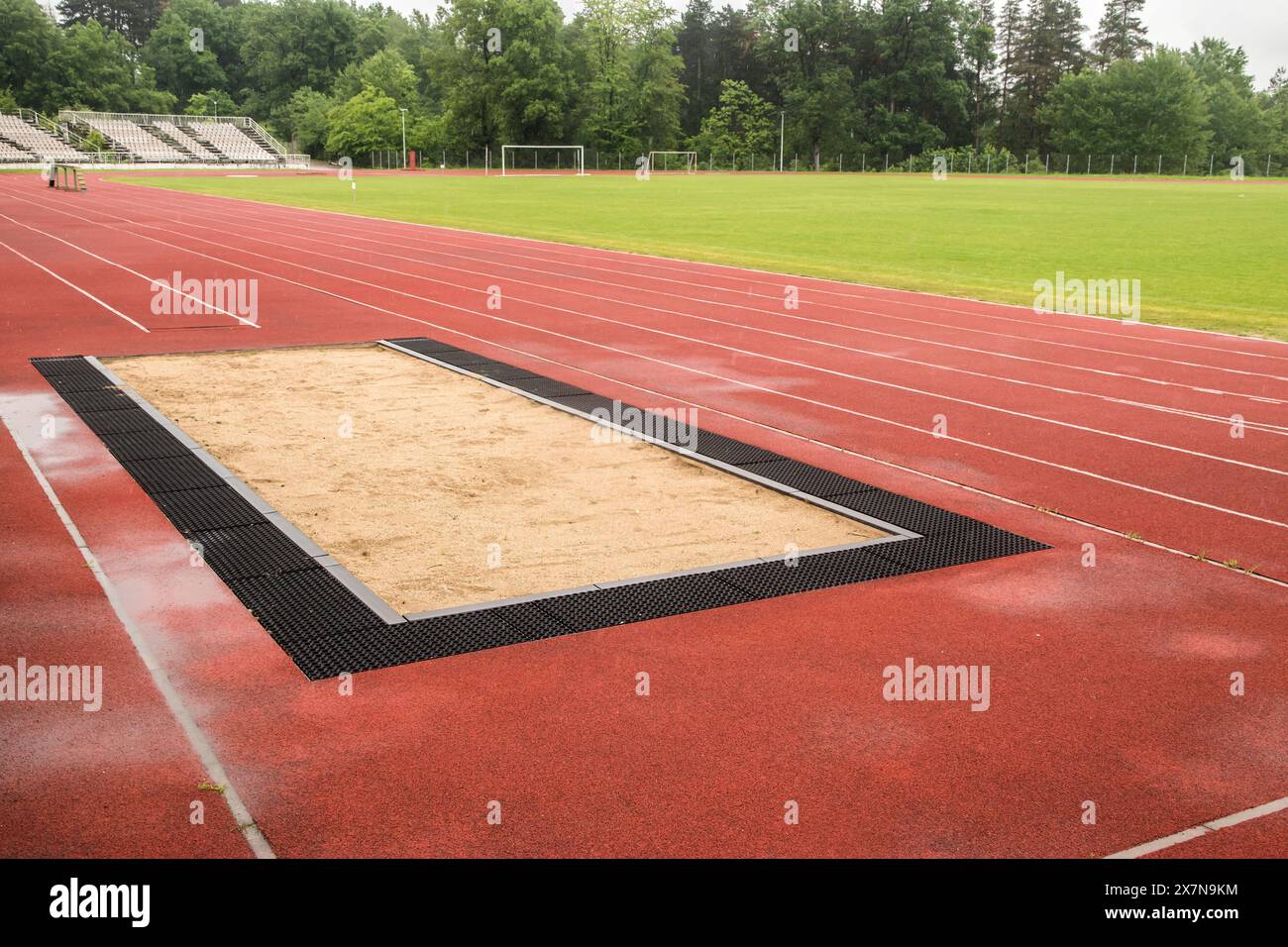 Long jump sand pit and track and field lines in stadium Stock Photo Alamy