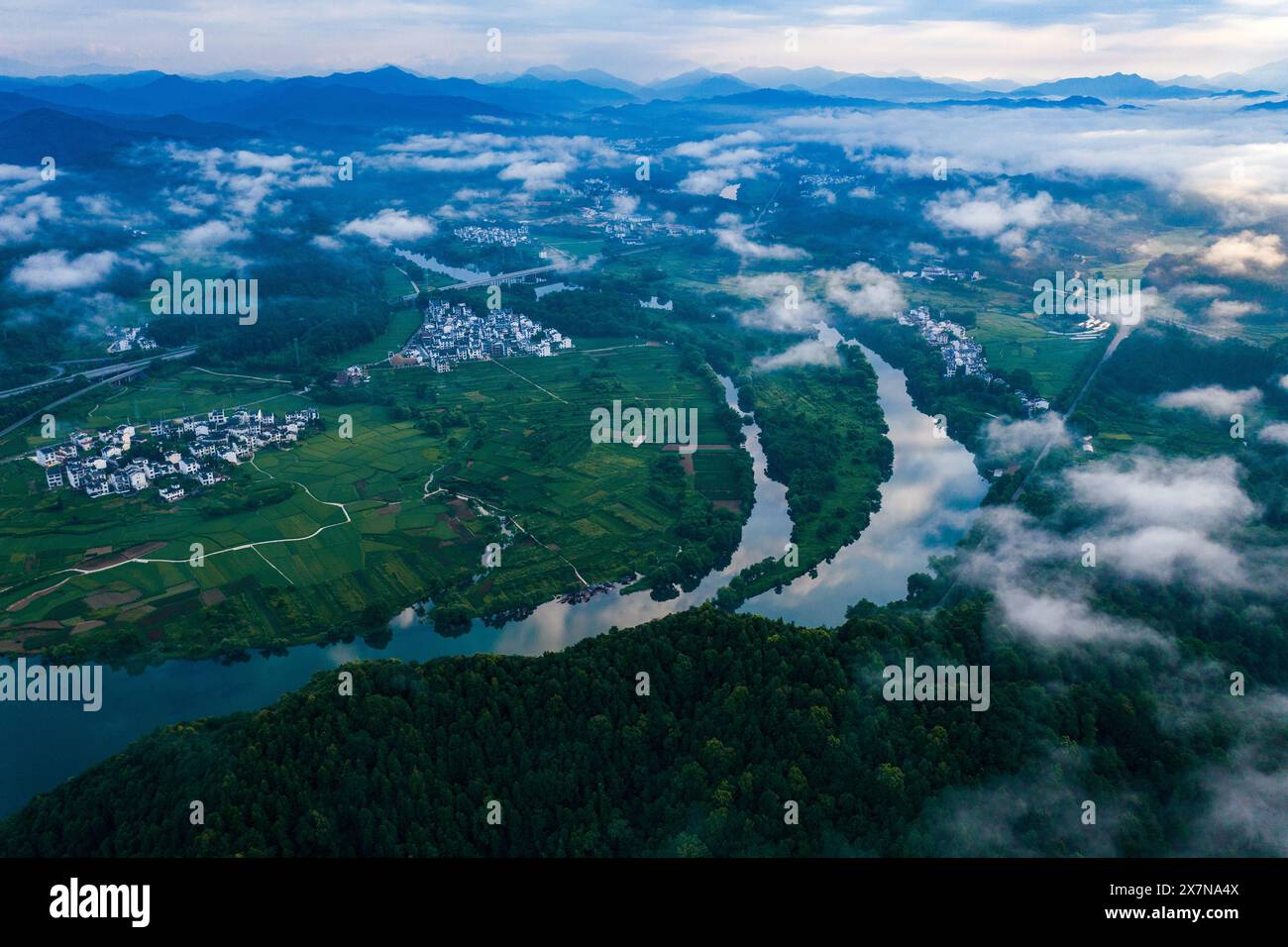 Beijing, China. 21st May, 2024. An aerial drone photo taken on April 13, 2023 shows the scenery of the Moon Bay in Wuyuan, east China's Jiangxi Province. Credit: Xinhua/Alamy Live News Stock Photo