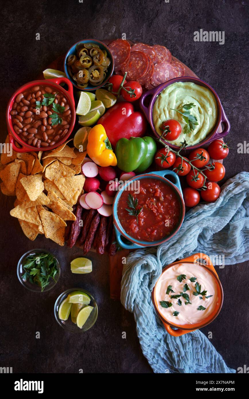 Mexican theme charcuterie board grazing platter with guacamole, salsa ...