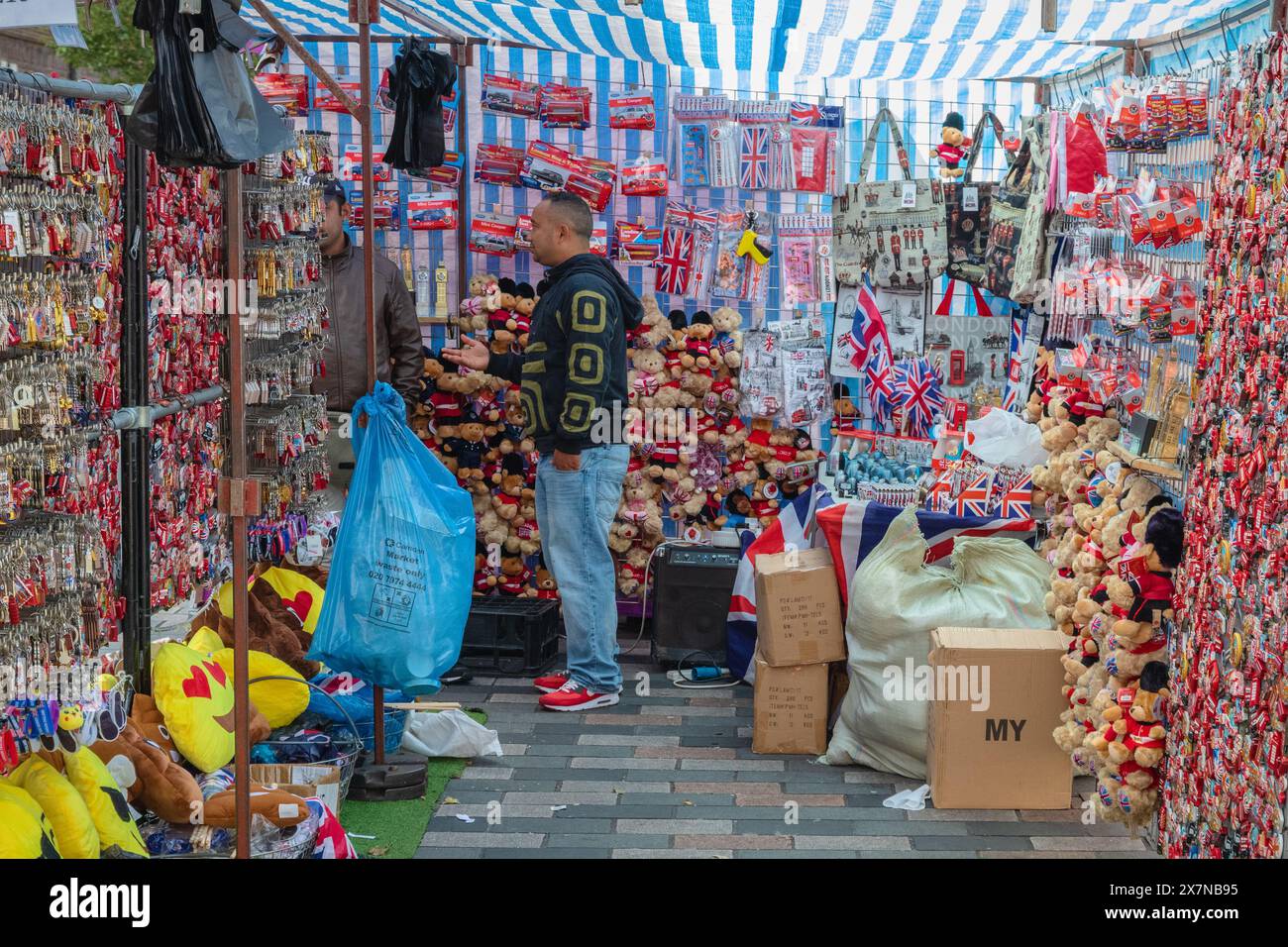 London UK September 12 2023 Souvenir Stall With Stall Holder At london-uk-september-12-2023-souvenir-stall-with-stall-holder-at