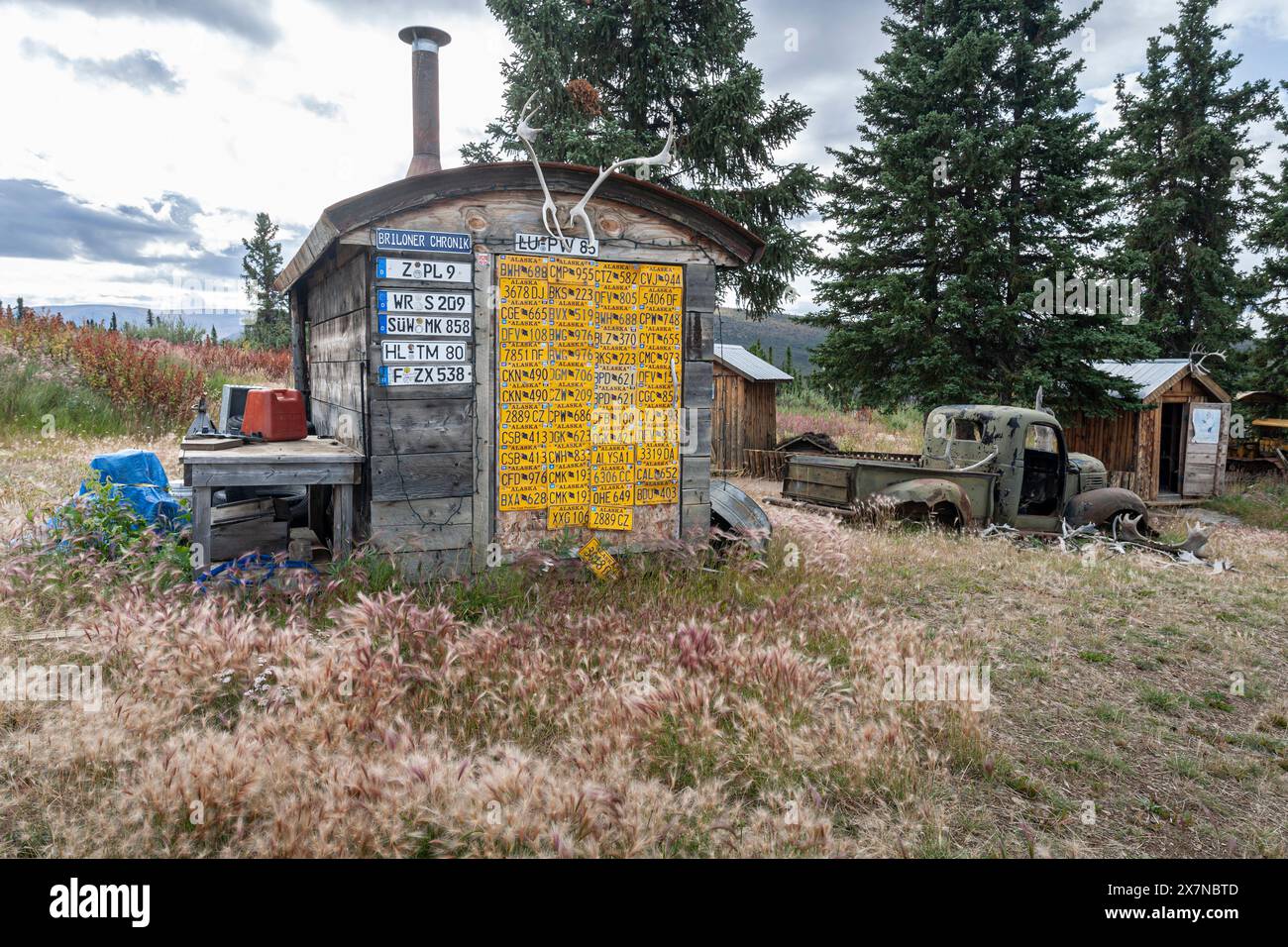 Funny log cabin with license plates, Top of the World Highway, Alaska ...