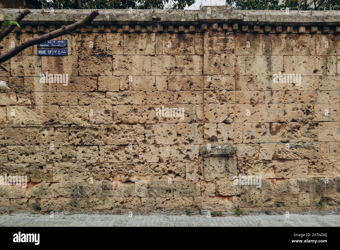 A wall in Beirut that bears traces of shots and explosions during the civil war Stock Photo