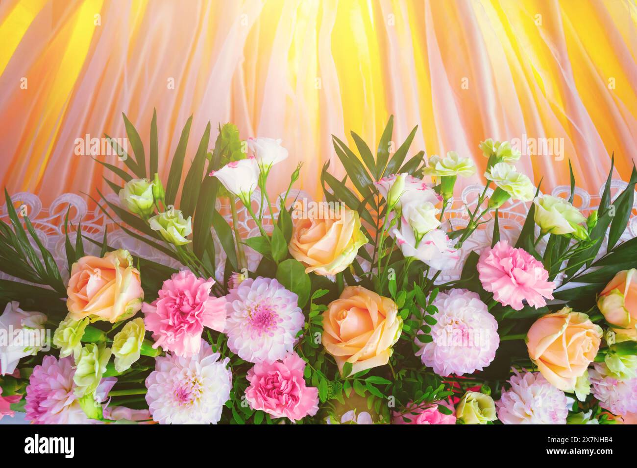 Festive flower composition on the yellow background. Overhead view Stock Photo