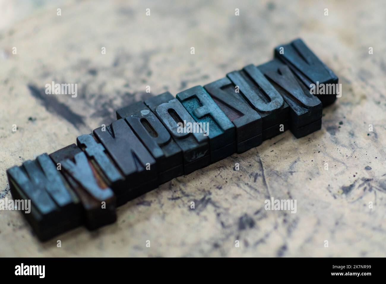 The movable wooden letterpress types are seen aligned on the composing table at an antique print shop in Cali, Colombia. Stock Photo