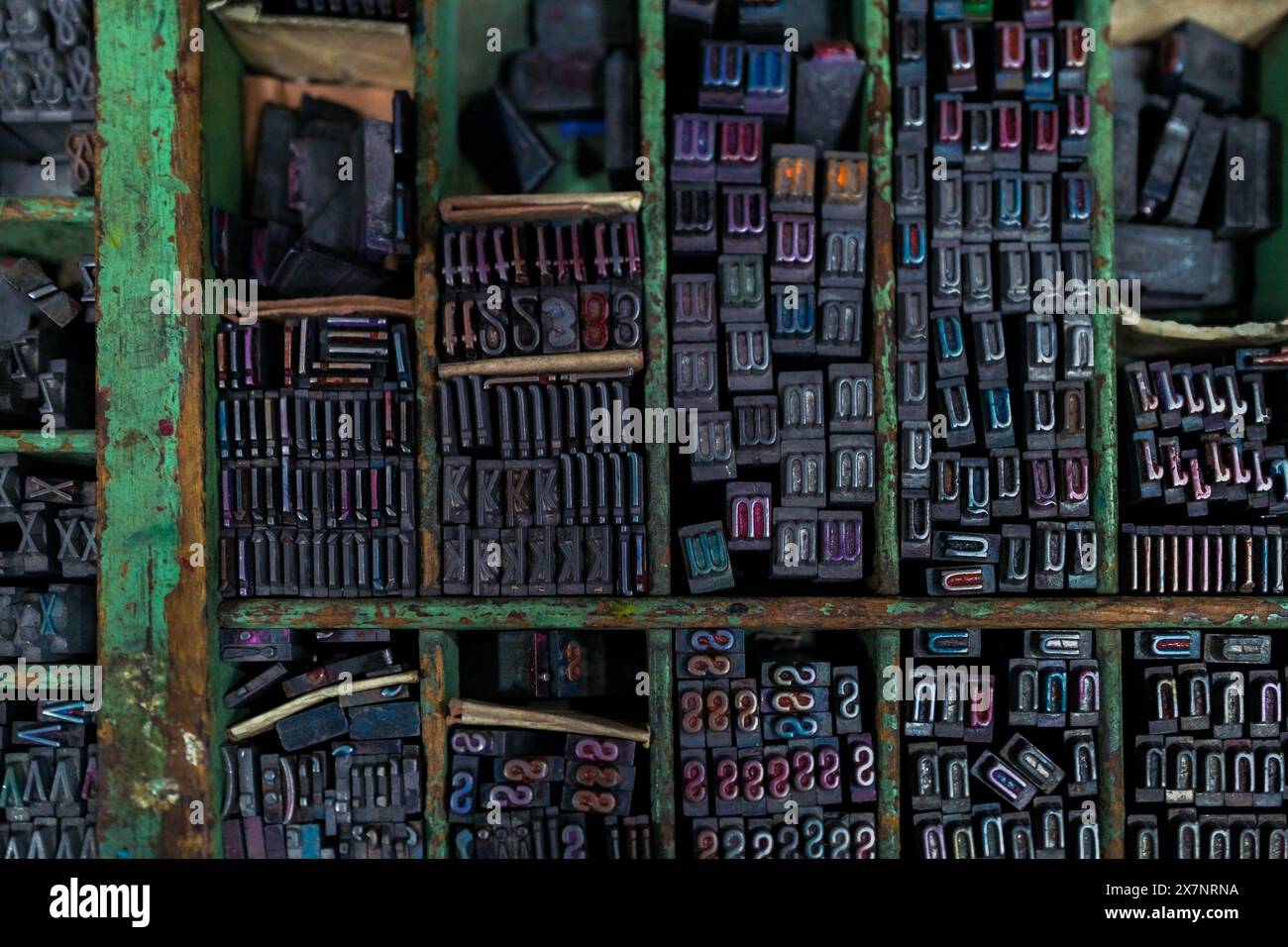 The movable metal letterpress types are seen stored in a type case at an antique print shop in Cali, Colombia. Stock Photo