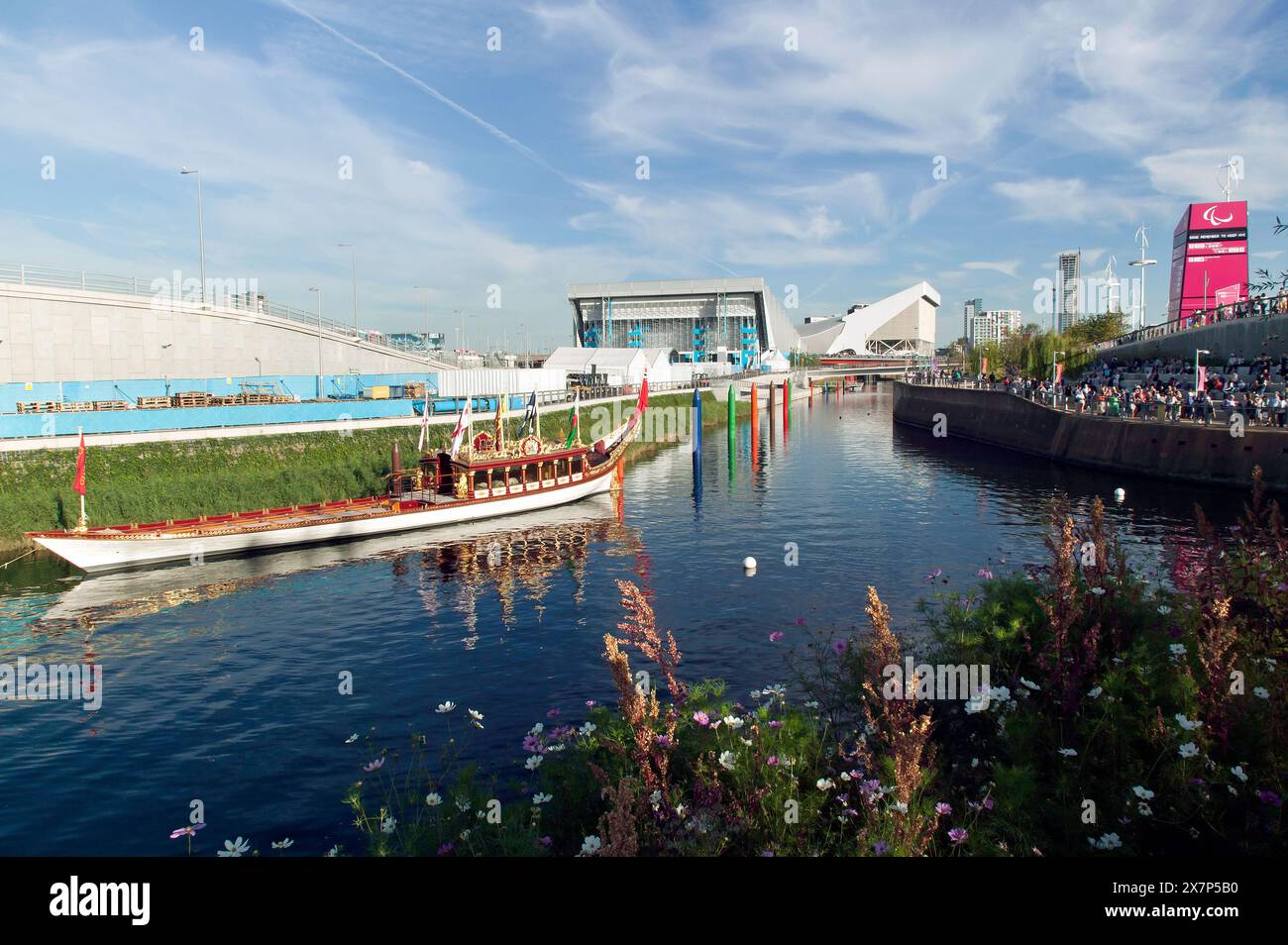 The River Lea in the Queen Elizabeth Olympic Park, during the 2012 Paralympics, showing the Royal Barge,  Water Polo  Arena and the Aquatics Centre Stock Photo