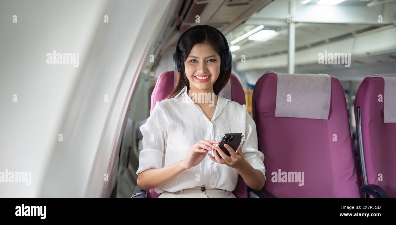 Woman holding plane seat hi-res stock photography and images - Alamy