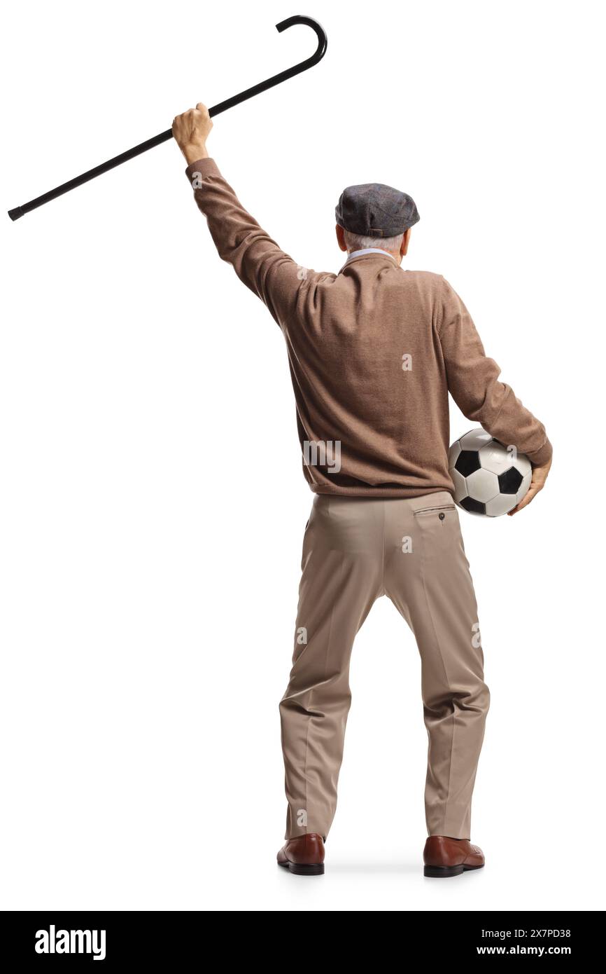 Rear view shot of a happy elderly man holding a football and a walking ...
