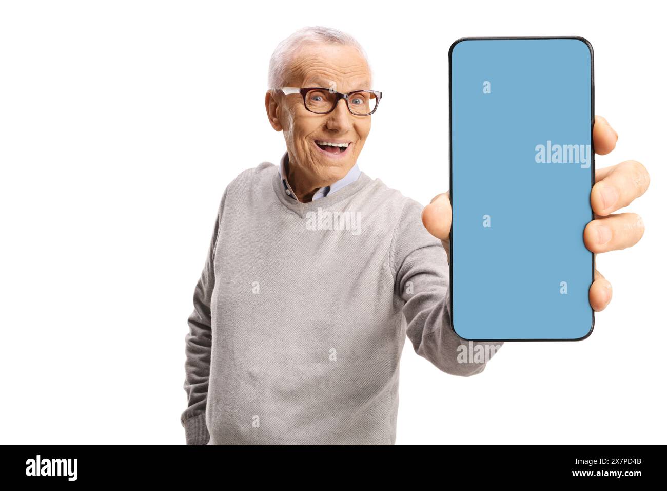 Pensioner holding a smartphone with a blue screen isolated on white background Stock Photo