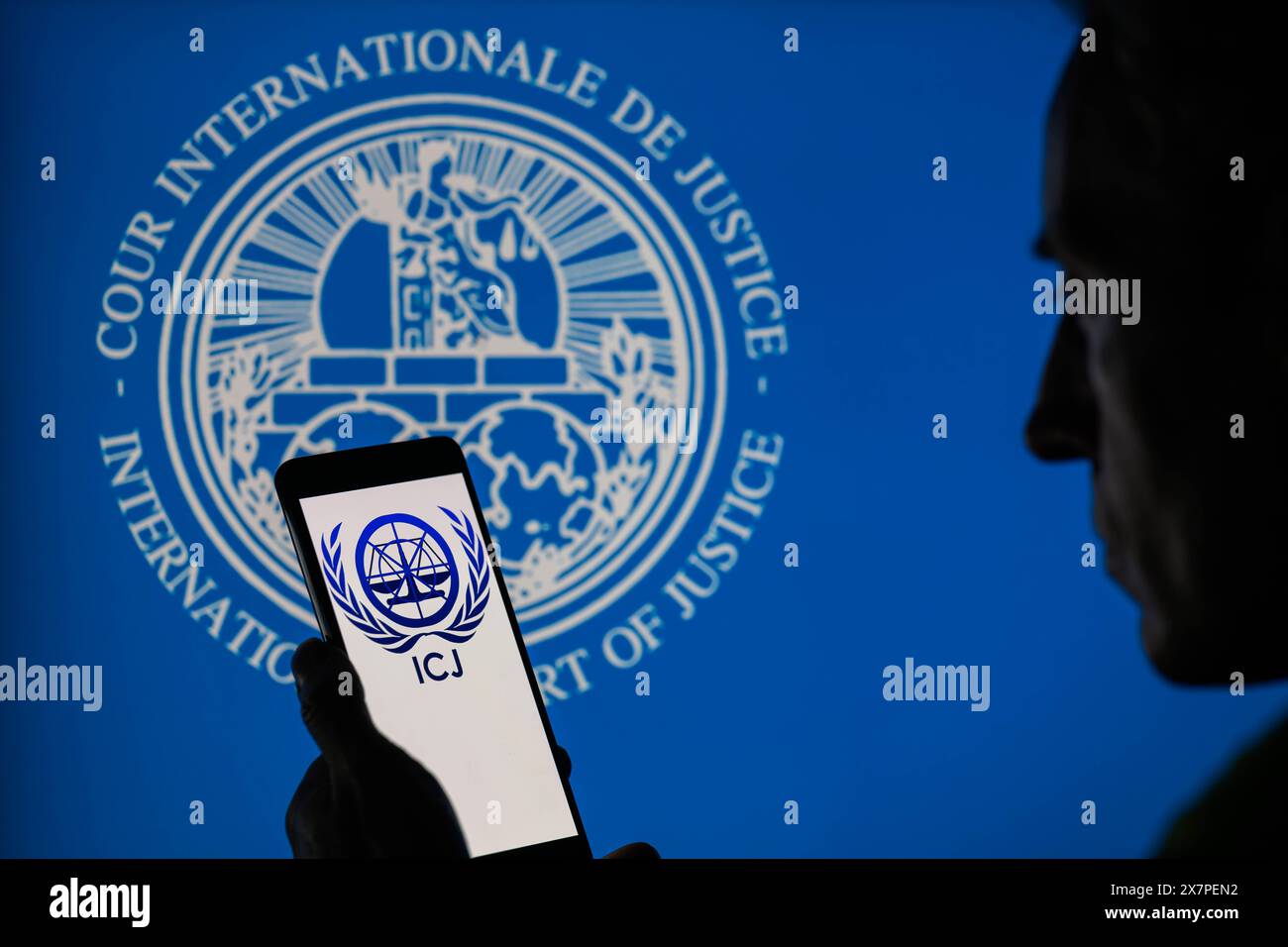 The International Court of Justice (ICJ) logo is displayed on a smartphone with ICJ seal visible in the background in this photo illustration. Taken in Brussels, Belgium. On May 20, 2024. (Jonathan Raa / Sipa USA) *** Strictly for editorial news purposes only *** Stock Photo