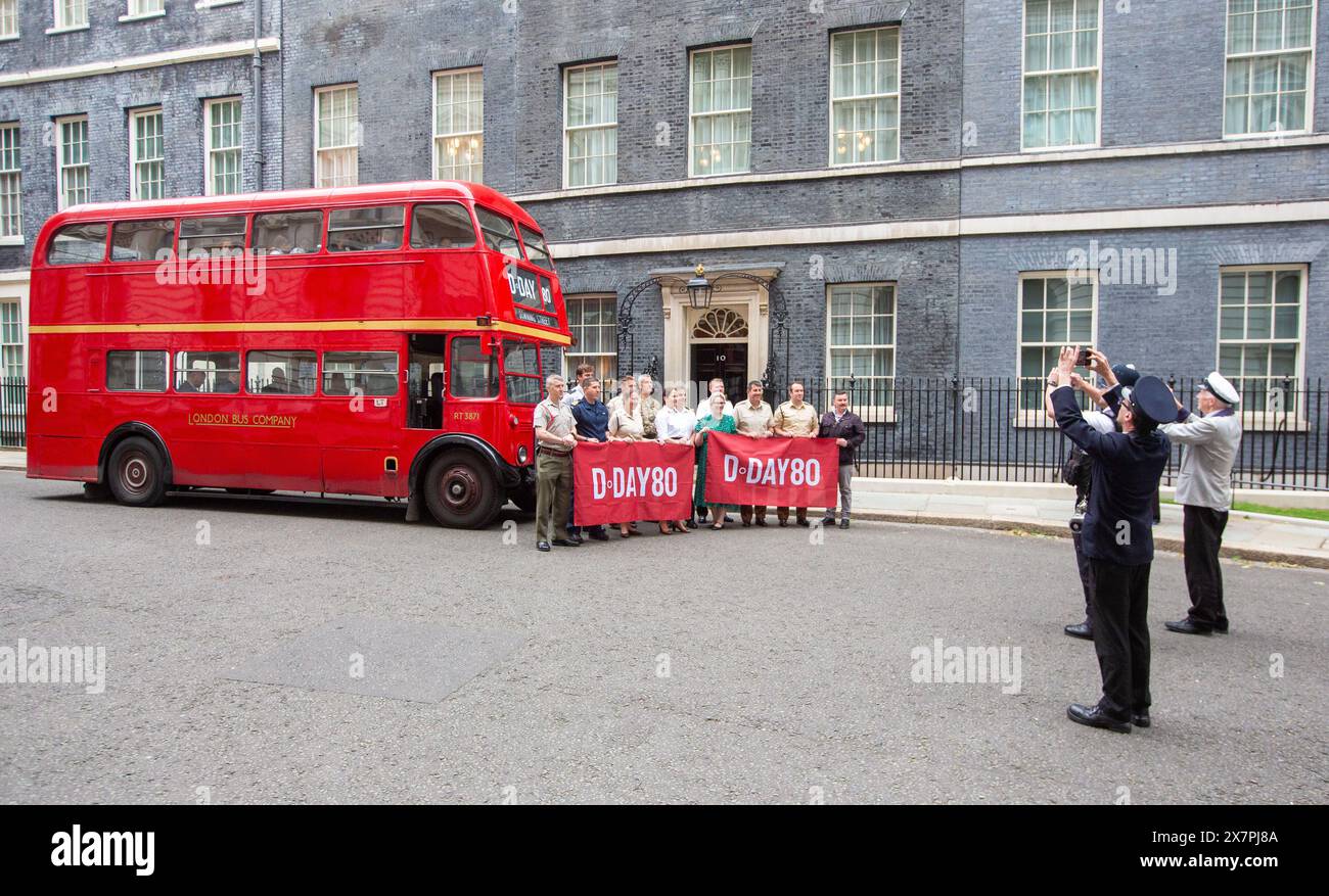 London, England, UK. 21st May, 2024. A 1950's AEC Regent III double decker bus of the London Bus Company is seen waiting outside Downing Street in London, to take schoolchildren attending a D-Day history lesson at number 10, to meet veterans on board HMS Belfast on the River Thames. (Credit Image: © Tayfun Salci/ZUMA Press Wire) EDITORIAL USAGE ONLY! Not for Commercial USAGE! Credit: ZUMA Press, Inc./Alamy Live News Stock Photo