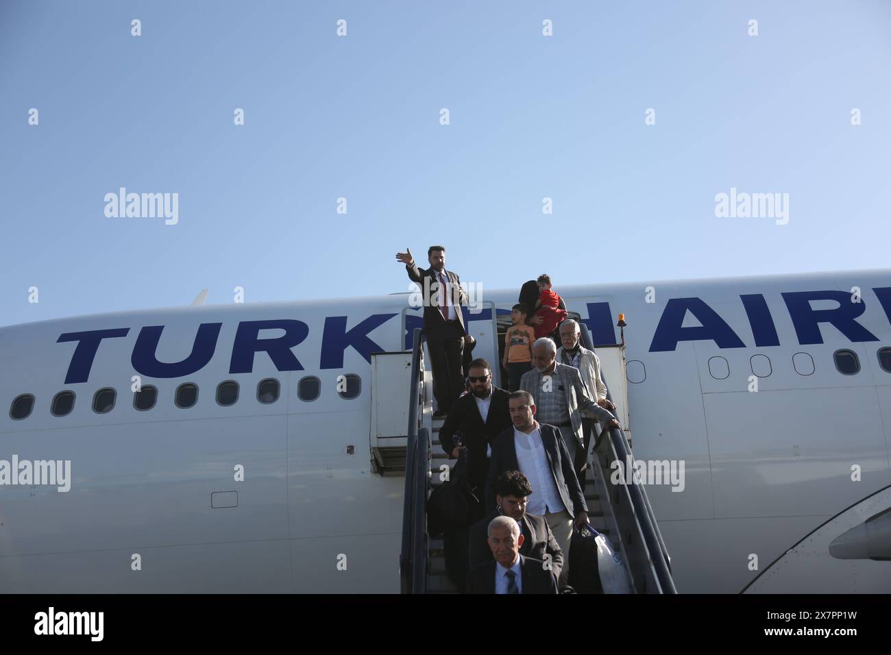 Kabul, Afghanistan. 21st May, 2024. Passengers get off a Turkish Airlines plane from T¨¹rkiye's Istanbul at the Kabul International Airport in Kabul, the capital of Afghanistan, May 21, 2024. A Turkish Airlines plane arrived at the Kabul International Airport on Tuesday morning, as the national flag carrier of T¨¹rkiye resumed its flights to Afghanistan following almost three years of suspension. Credit: Saifurahman Safi/Xinhua/Alamy Live News Stock Photo