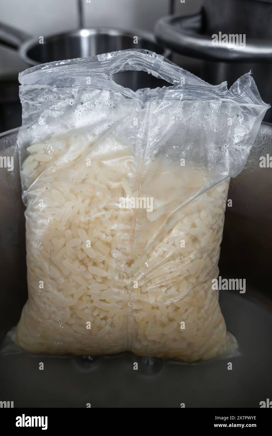 Preccoked Rice Pack A kitchen scene with a metal saucepan on an electric stovetop ...
