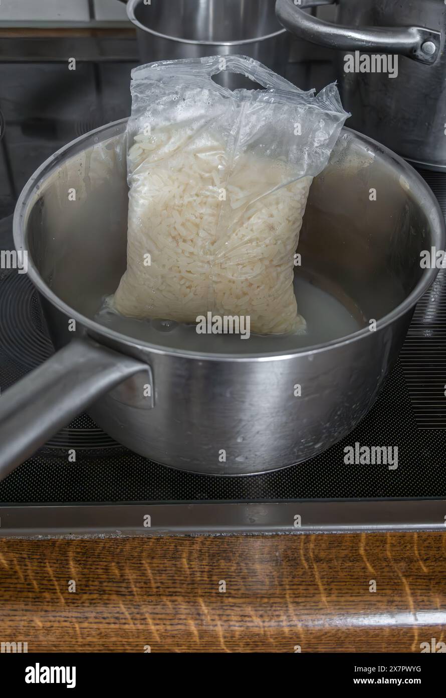 Preccoked Rice Pack A kitchen scene with a metal saucepan on an electric stovetop ...