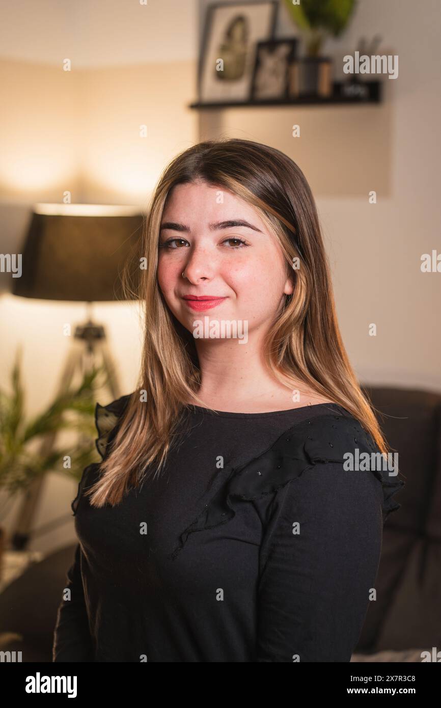 Woman in black top indoors hi-res stock photography and images - Alamy