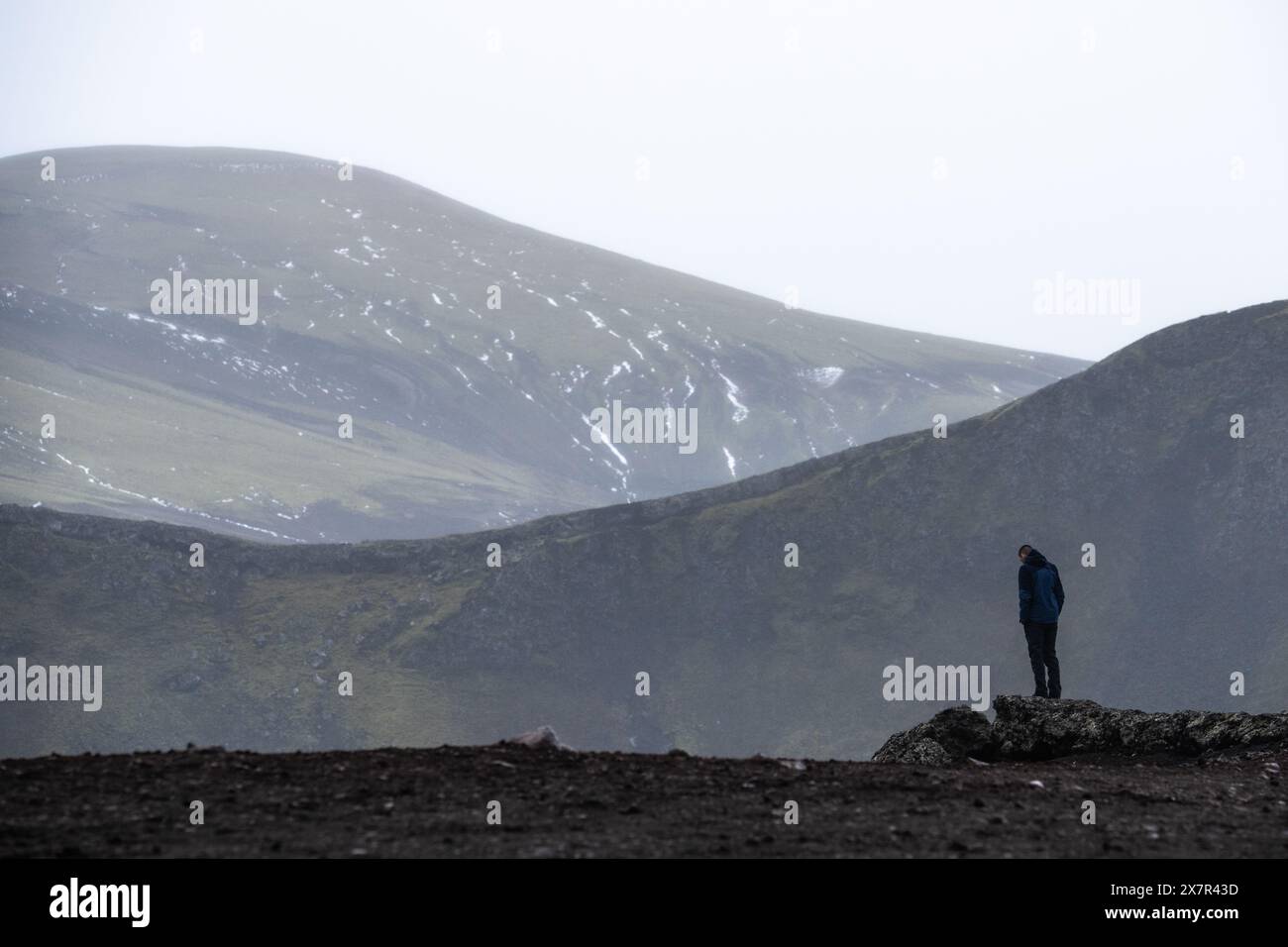 Solitary figure shrouded in hi-res stock photography and images - Alamy