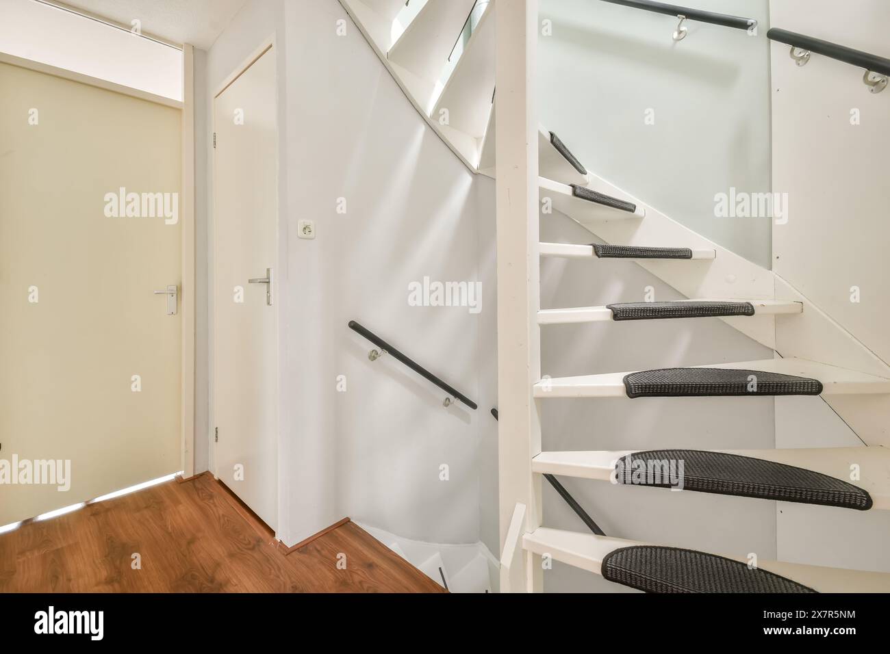 Contemporary white staircase with carpeted steps and minimalist design ...