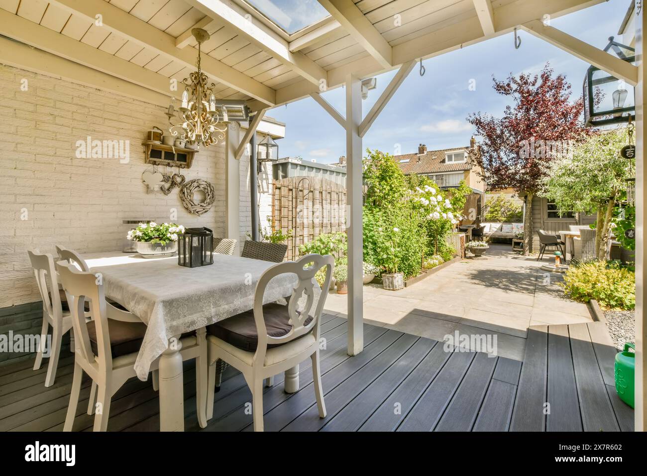 This cozy and stylish outdoor dining spot, nestled in a private garden