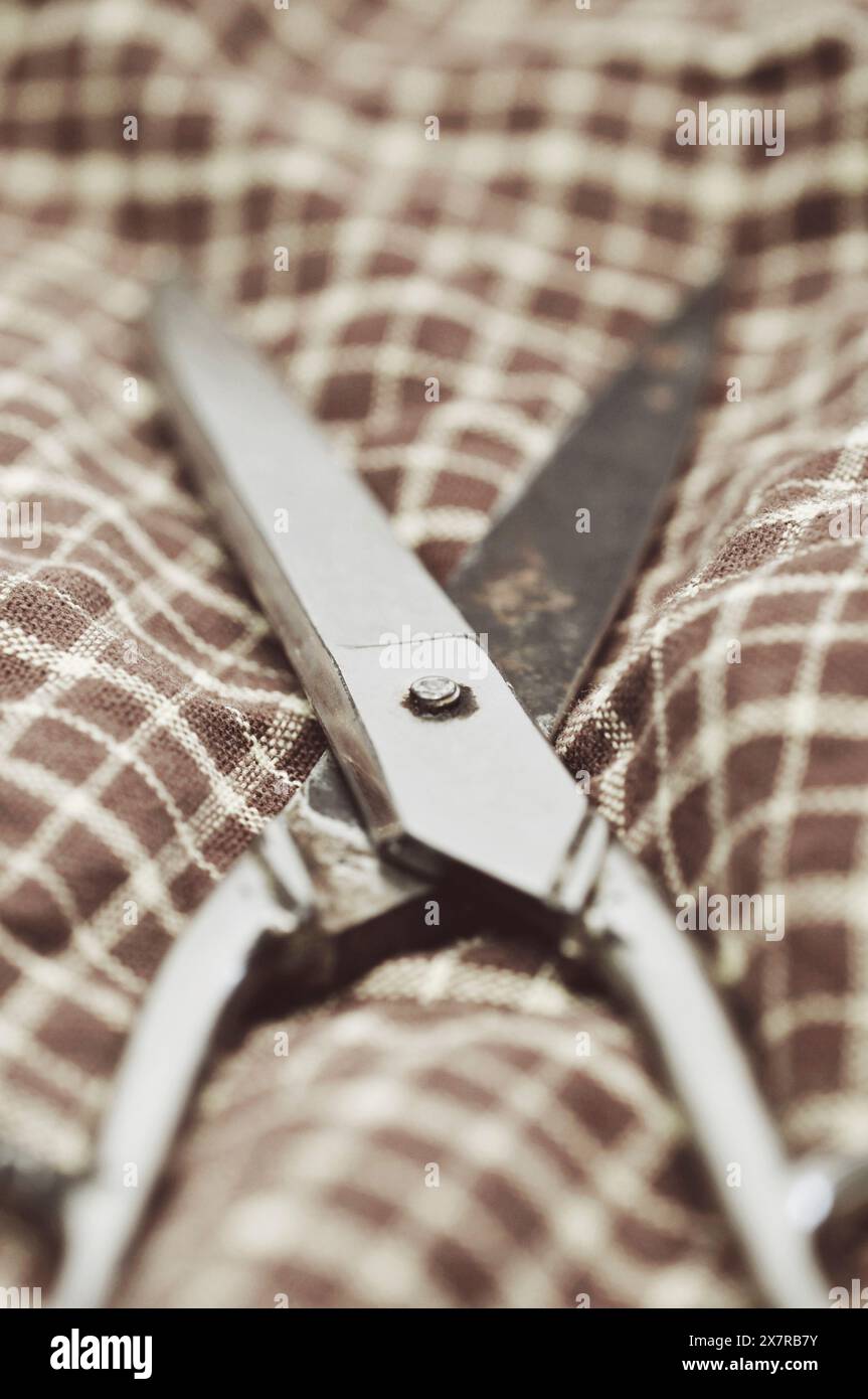 Old scissors on fabric Stock Photo