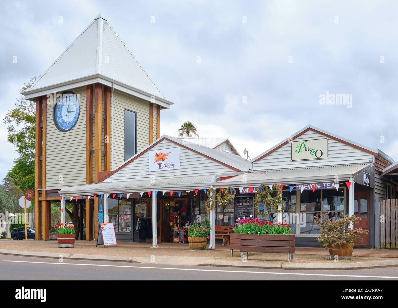 The Nannup Clock Tower, shopfronts and tulip displays in the main street of the rural timber town of Nannup in south-west Western Australia. Stock Photo