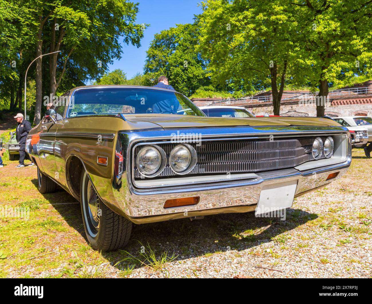 Stade, Germany – May 11, 2024: Low angle view of Chrysler New Yorker hardtop muscle car from 1969 displayed at Mopar Spring Fling meeting and exhibiti Stock Photo