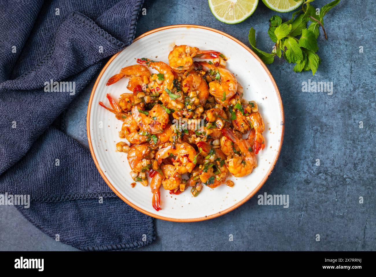 selective focus of Butter Garlic Prawn with a black background. Stock Photo