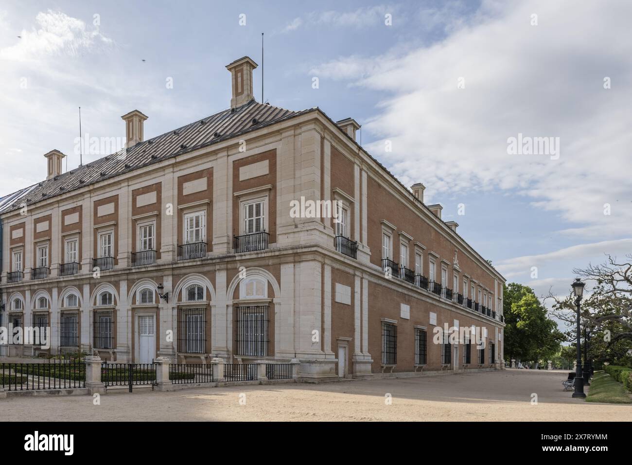 Two-story monumental building among gardens of the royal site of Aranjuez in Madrid Stock Photo